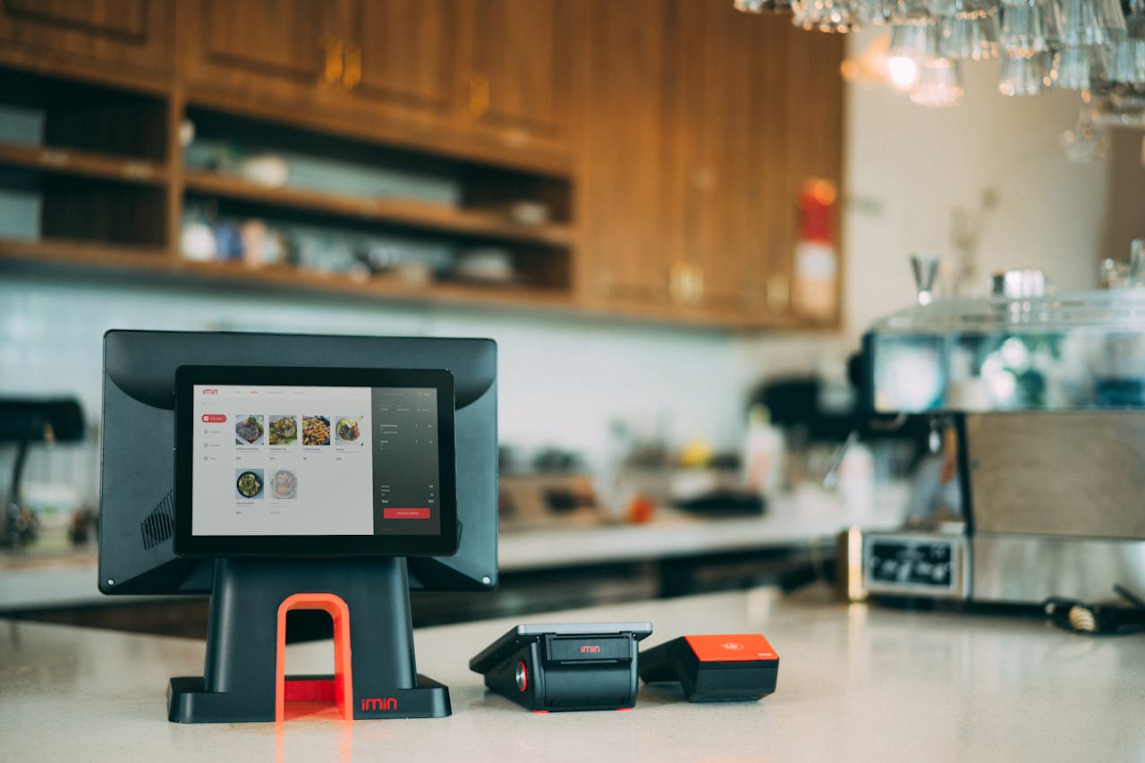 mobile-02 A sleek digital point-of-sale system in a contemporary restaurant setting, showcasing cashless payment technology.